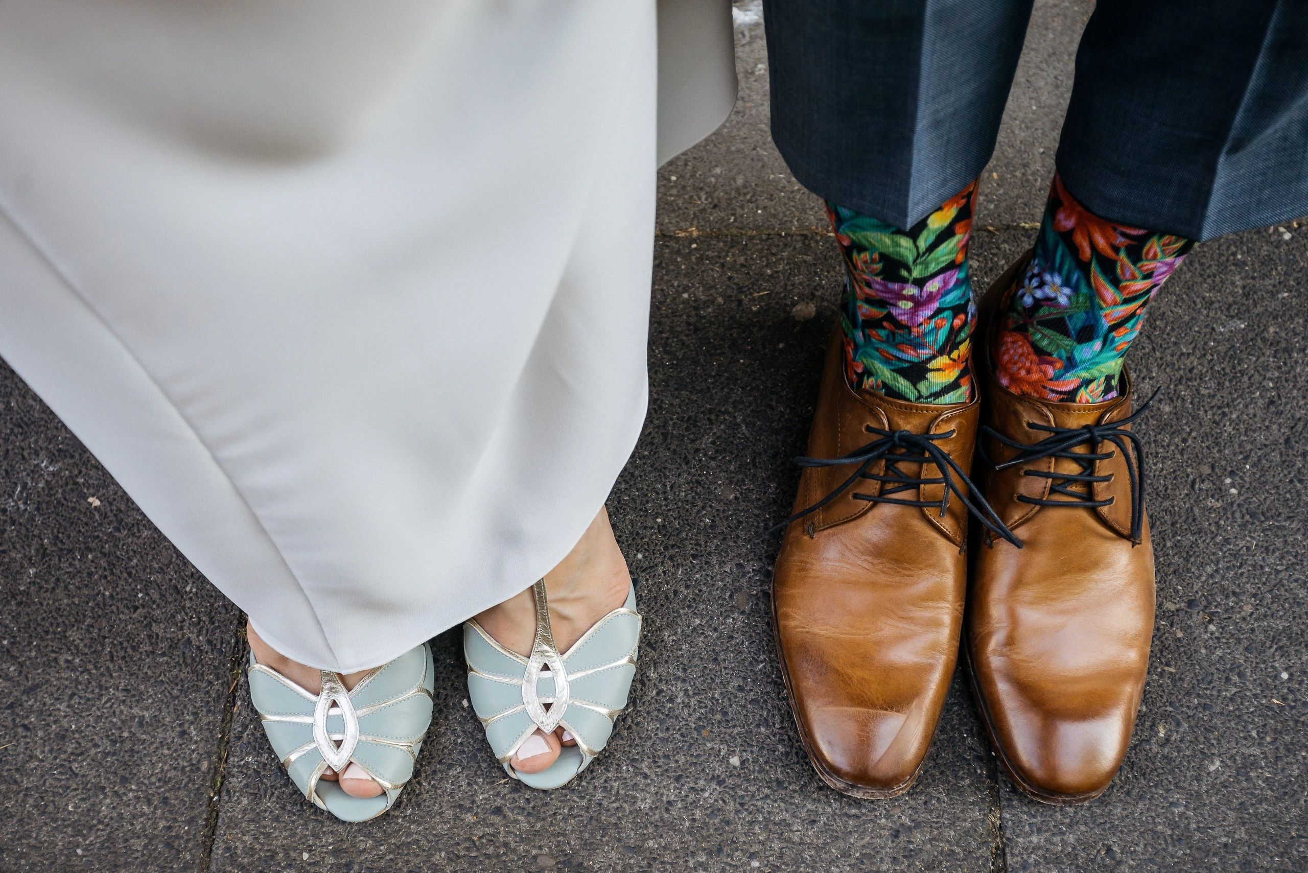 Couple feet in wedding footwear